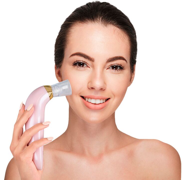 The girl holds a skin rejuvenation device